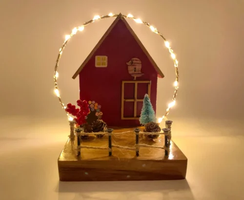 Red Cottage With String Lights Decor